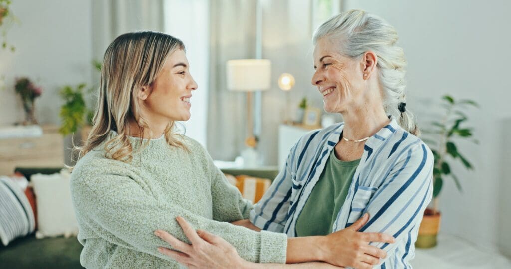 Senior woman, caregiver and hug with empathy for healthcare, comfort and treatment in elderly care