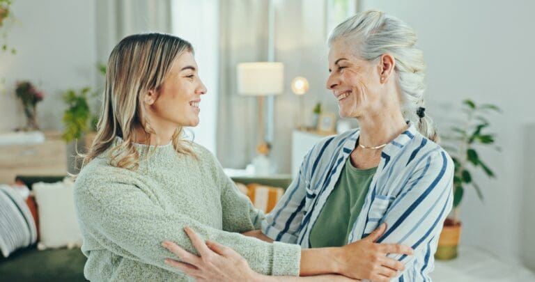 Senior woman, caregiver and hug with empathy for healthcare, comfort and treatment in elderly care