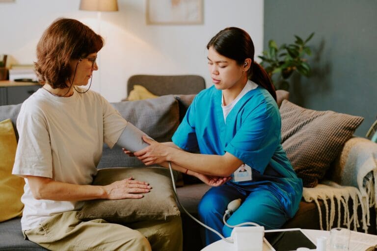 Checking Blood Pressure During Home Health Visit