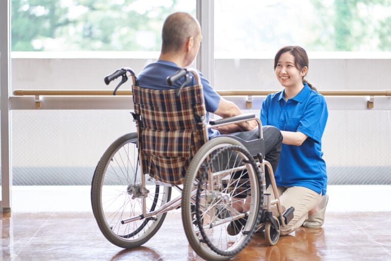 Wheelchair riding elderly and caregivers